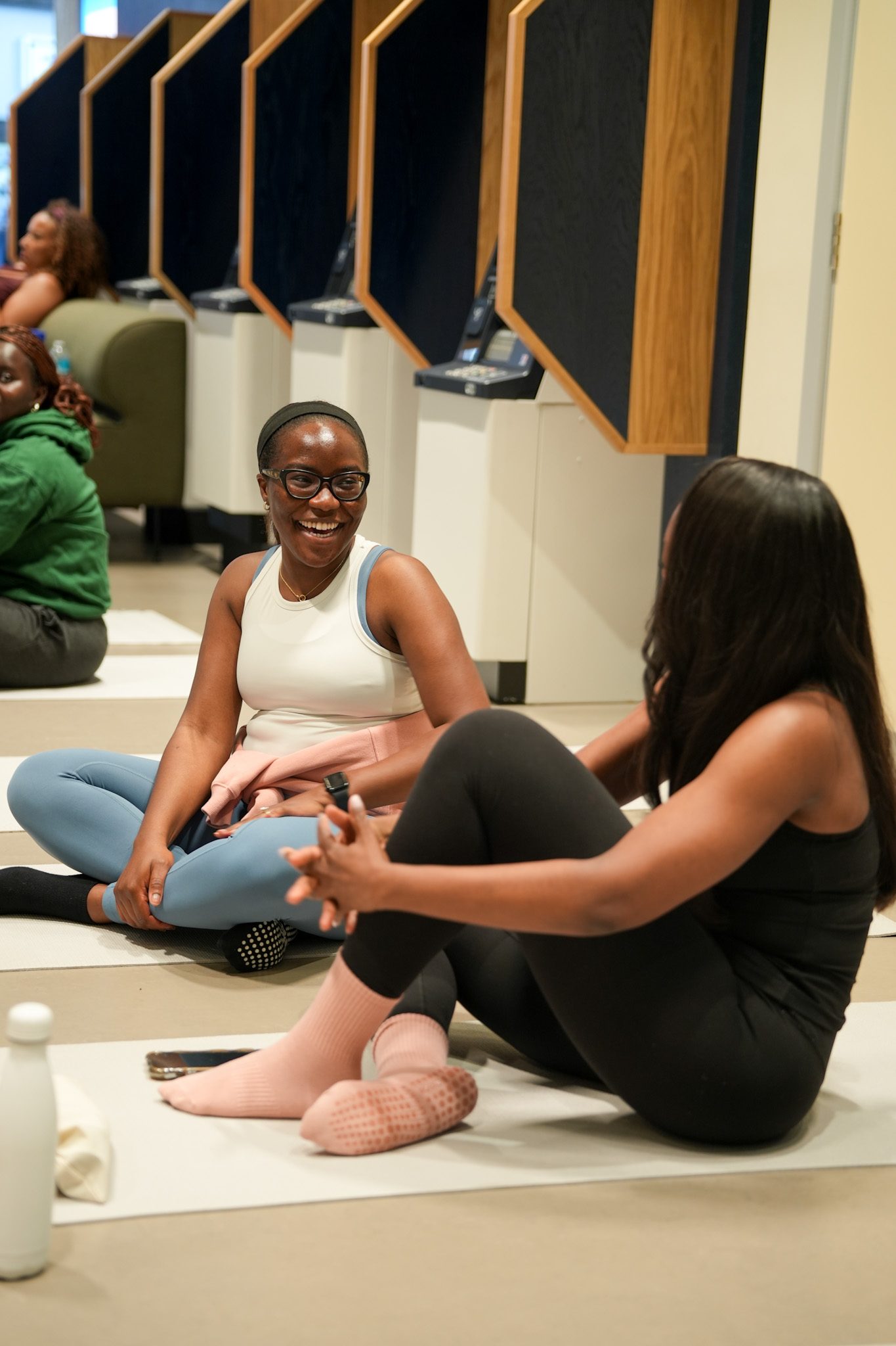 Guests laughing together at a wellness event